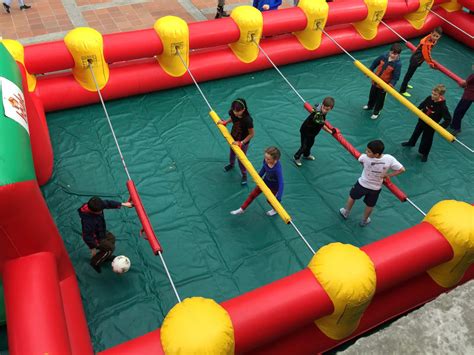 Human foosball - This awesome inflatable allows you and nine friends to compete in a life-size foosball game! Work together to score goals and beat your opponents! Great for team building! Rent this new piece today! 110V Outlet: 1. Actual Size: 20′ W x 45′ L x 7′ H. Space Required: 